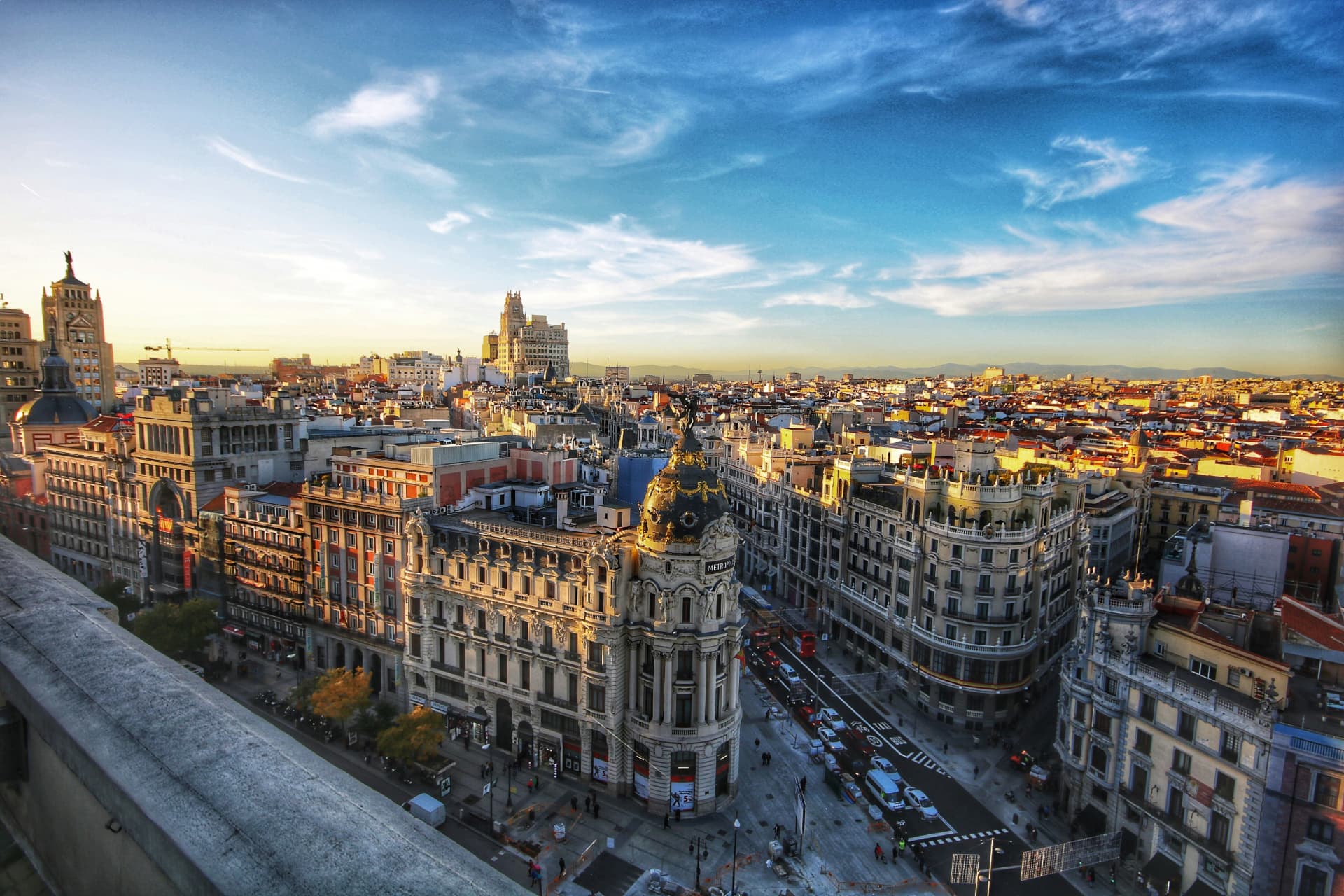 Gran Vía and the Metropolis building in Madrid at sunset